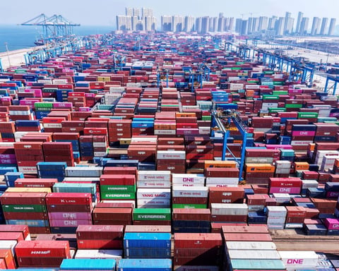 Shipping containers stacked at Qingdao port in China