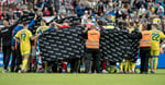 Denmark and Ukraine players surrounding Christian Eriksen after he collapsed at Nature Energy Park Odense June 2026