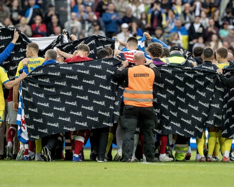 Denmark and Ukraine players surrounding Christian Eriksen after he collapsed at Nature Energy Park Odense June 2026