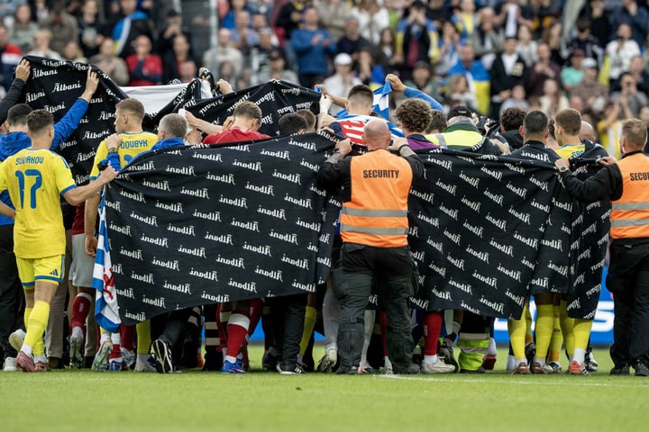 Denmark and Ukraine players surrounding Christian Eriksen after he collapsed at Nature Energy Park Odense June 2026