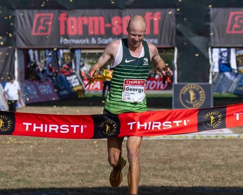 George Kusche crosses the finish line at Hollywoodbets Scottsville Racecourse to win the 2026 Comrades Marathon in Pietermaritzburg