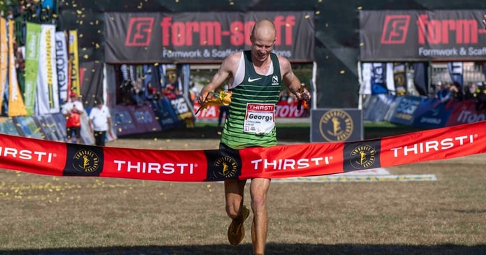 George Kusche crosses the finish line at Hollywoodbets Scottsville Racecourse to win the 2026 Comrades Marathon in Pietermaritzburg