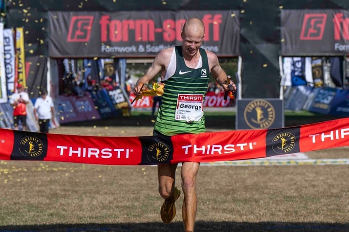 George Kusche crosses the finish line at Hollywoodbets Scottsville Racecourse to win the 2026 Comrades Marathon in Pietermaritzburg
