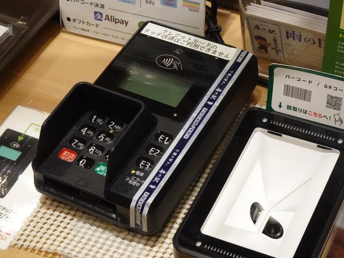 A credit card payment terminal, the point where merchants pay the interchange fees at the center of the 38 billion dollar settlement