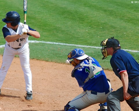 A batter making contact in a baseball game, illustrating the Diamondbacks' win over the Angels