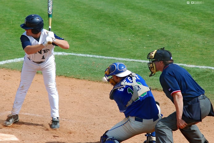A batter making contact in a baseball game, illustrating the Diamondbacks' win over the Angels