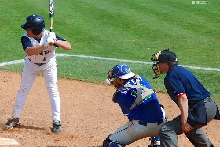 A batter making contact in a baseball game, illustrating the Diamondbacks' win over the Angels