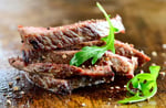 Grilled lean pork and meat on a plate representing animal-based protein sources tested in Purdue University amino acid study
