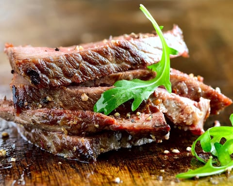 Grilled lean pork and meat on a plate representing animal-based protein sources tested in Purdue University amino acid study