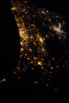 NASA astronaut nighttime photograph from the International Space Station of the Eastern Mediterranean coastline showing Tel Aviv as the brightest cluster Jerusalem and Amman as additional bright clusters with highways snaking between them