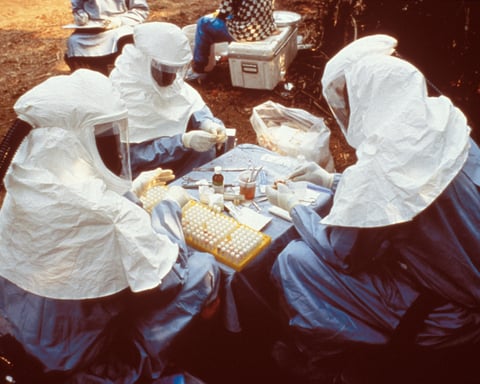 Scientists wearing personal protective equipment during an Ebola outbreak response in DRC