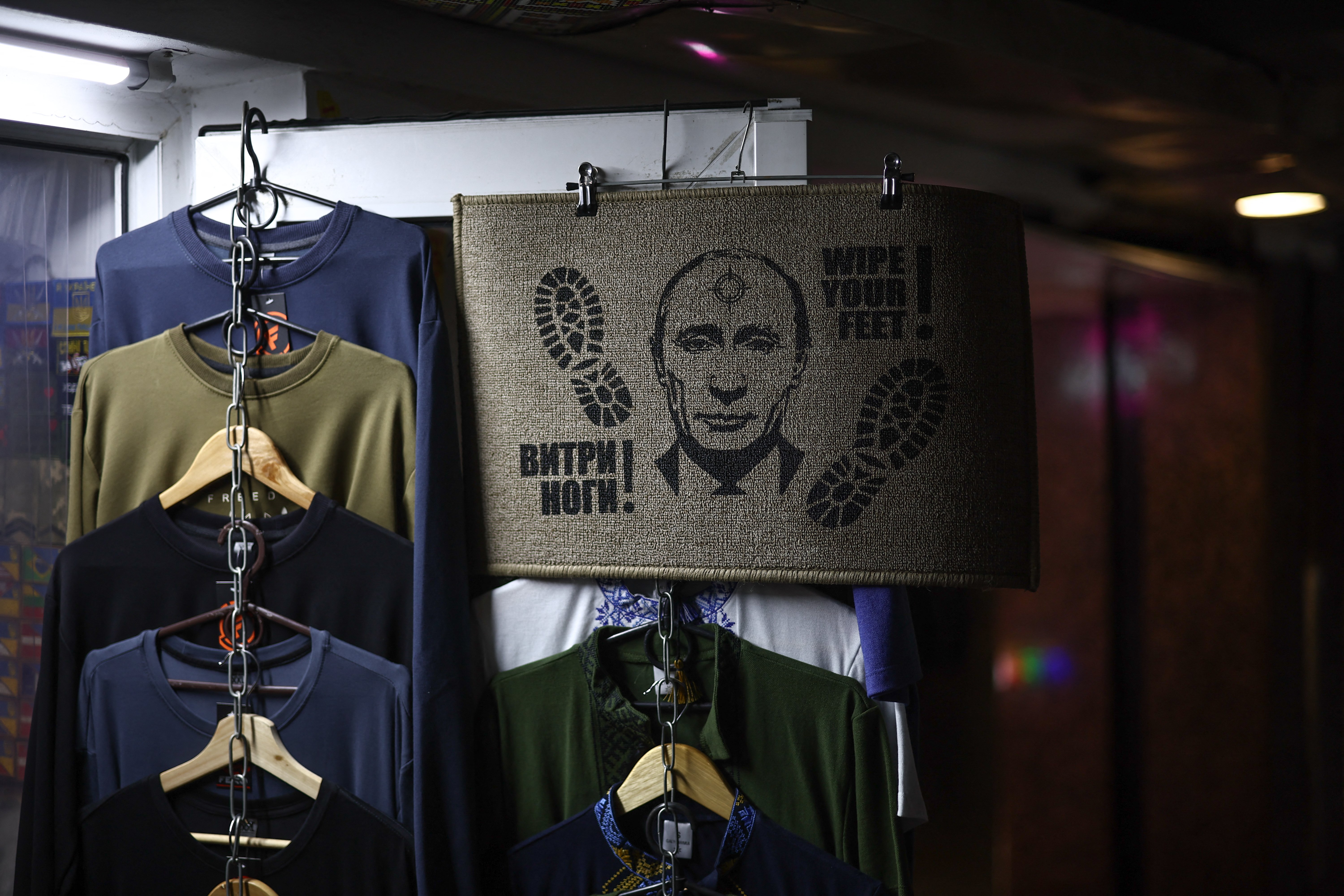 A doormat featuring Russian President Vladimir Putin outside a shop in Kyiv, Ukraine, on the four-year anniversary of Russia's military operation