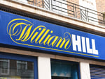William Hill betting shop exterior Britain Evoke Bally's Intralot takeover 2026