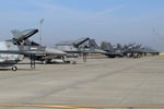 US Air Force F-15E Strike Eagles and F-16 fighter jets in flight, the aircraft being cut from NATO's European posture