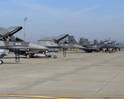 US Air Force F-15E Strike Eagles and F-16 fighter jets in flight, the aircraft being cut from NATO's European posture