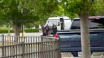FBI agents carry out a search of an office during a federal operation