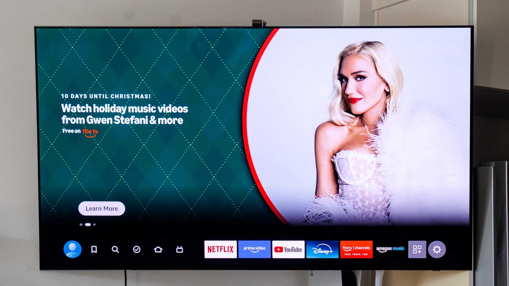 Wall-mounted TV streaming content via Amazon Fire TV Stick 4K Select connected through HDMI port