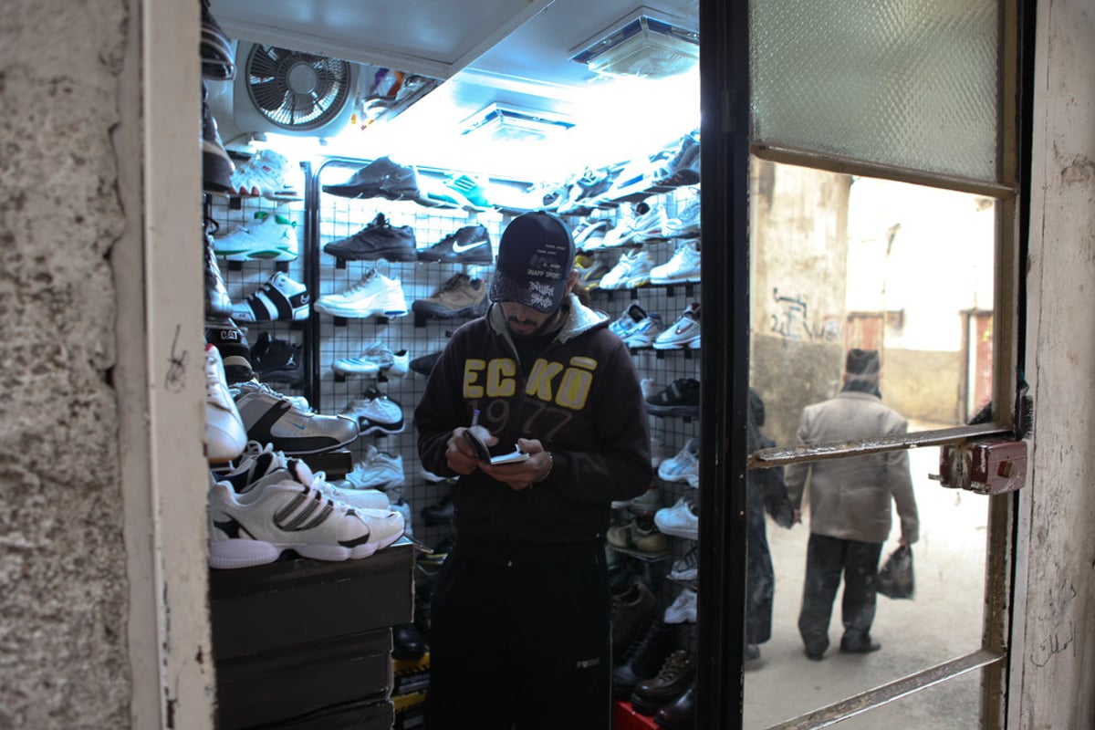 A sneaker store interior, illustrating the Accent Group footwear retail takeover bid