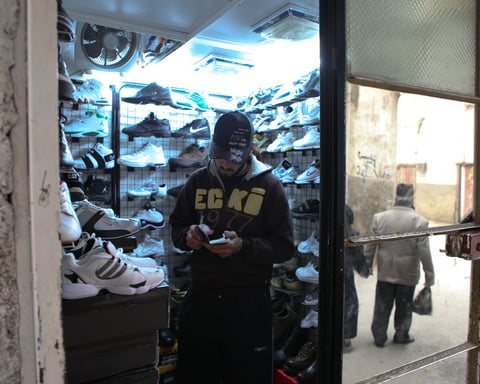 A sneaker store interior, illustrating the Accent Group footwear retail takeover bid