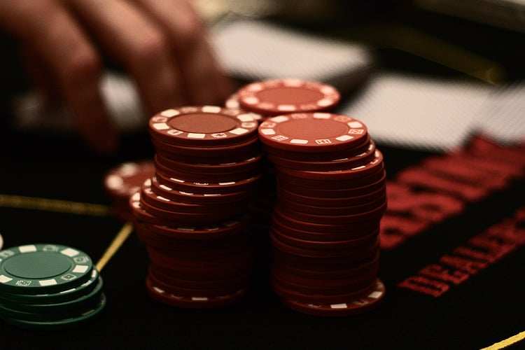 Gambling chips representing the financial stakes in the CFTC versus Kentucky prediction markets legal battle