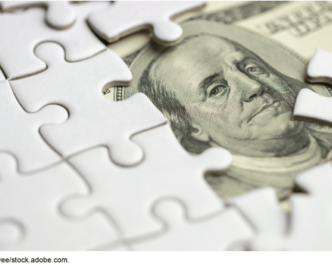 White puzzle pieces obscuring a US hundred dollar bill symbolizing shell company opacity and money laundering risks