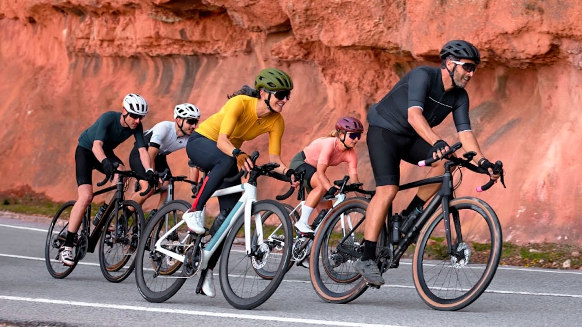 Garmin cyclists wearing smartwatches during a ride