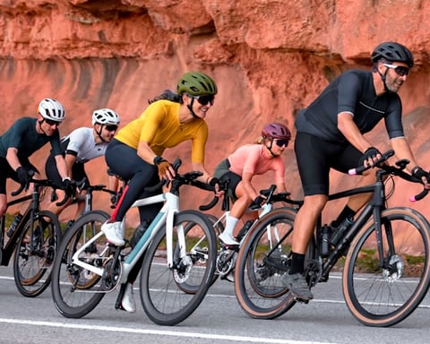 Garmin cyclists wearing smartwatches during a ride