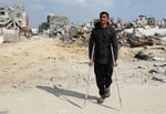 A Palestinian man walks through the rubble of destroyed buildings in Gaza after Israeli attacks, as the US approves a $6.7 billion weapons deal for Israel