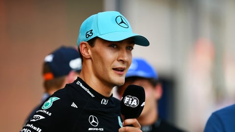 George Russell celebrates on the podium after winning the 2026 Austrian Grand Prix at the Red Bull Ring in Spielberg