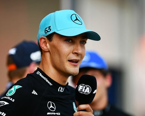 George Russell celebrates on the podium after winning the 2026 Austrian Grand Prix at the Red Bull Ring in Spielberg