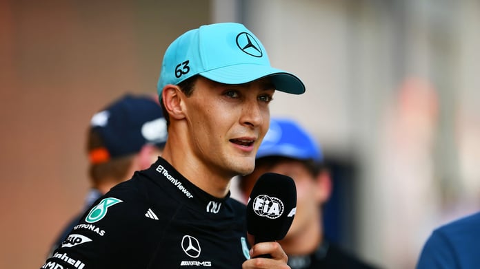George Russell celebrates on the podium after winning the 2026 Austrian Grand Prix at the Red Bull Ring in Spielberg