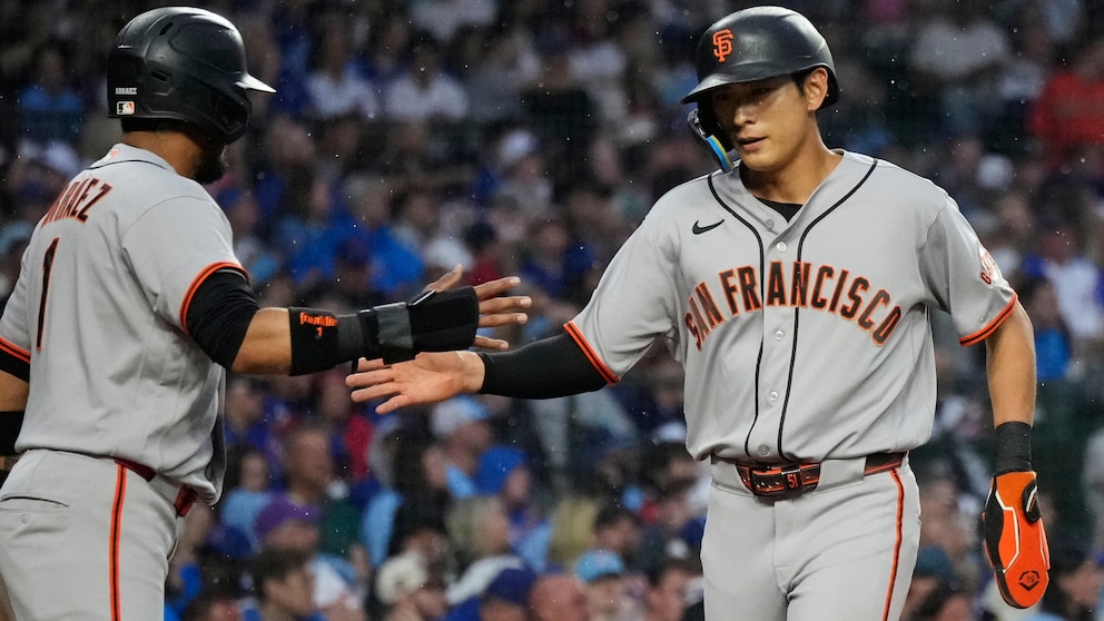 San Francisco Giants celebrate Matt Chapman's walk-off RBI single in the 10th inning against the Chicago Cubs at Wrigley Field