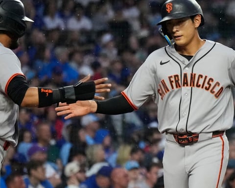 Jung Hoo Lee gets a high-five from Luis Arraez after his RBI single in the first inning against the Cubs at Wrigley Field
