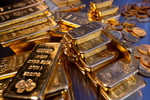 Stacked gold bullion bars in a central bank vault as ECB confirms gold has overtaken US Treasuries in global reserves