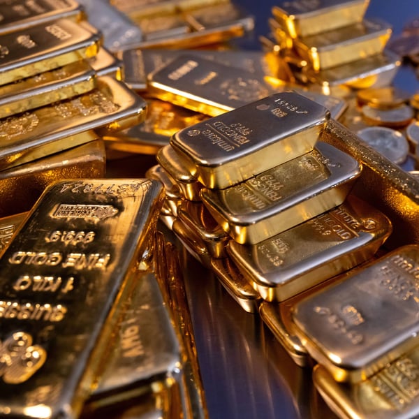 Stacked gold bullion bars in a central bank vault as ECB confirms gold has overtaken US Treasuries in global reserves