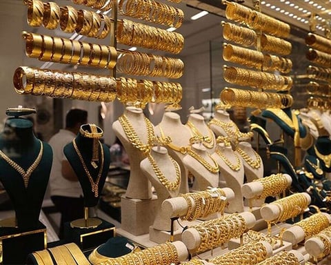 Gold bars and bullion representing the spot gold market as prices fall below the 200-day moving average in June 2026