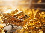 Gold bars and price chart showing decline amid US-Iran conflict and Federal Reserve rate hike expectations June 2026
