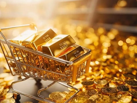 Gold bars and price chart showing decline amid US-Iran conflict and Federal Reserve rate hike expectations June 2026