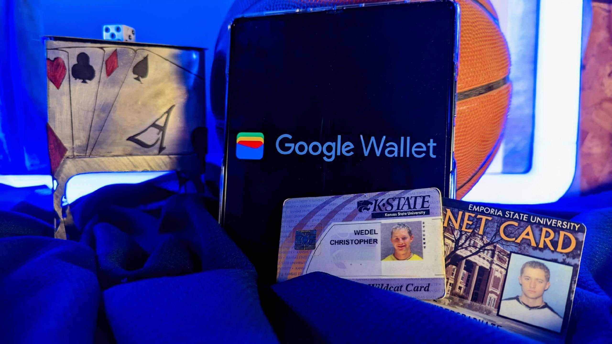 Android phone displaying Google Wallet app logo with college IDs showing digital identity support