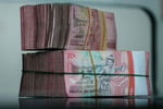 Yuan and rupiah banknotes as Hong Kong, Indonesia and the People's Bank of China sign a direct currency settlement MoU