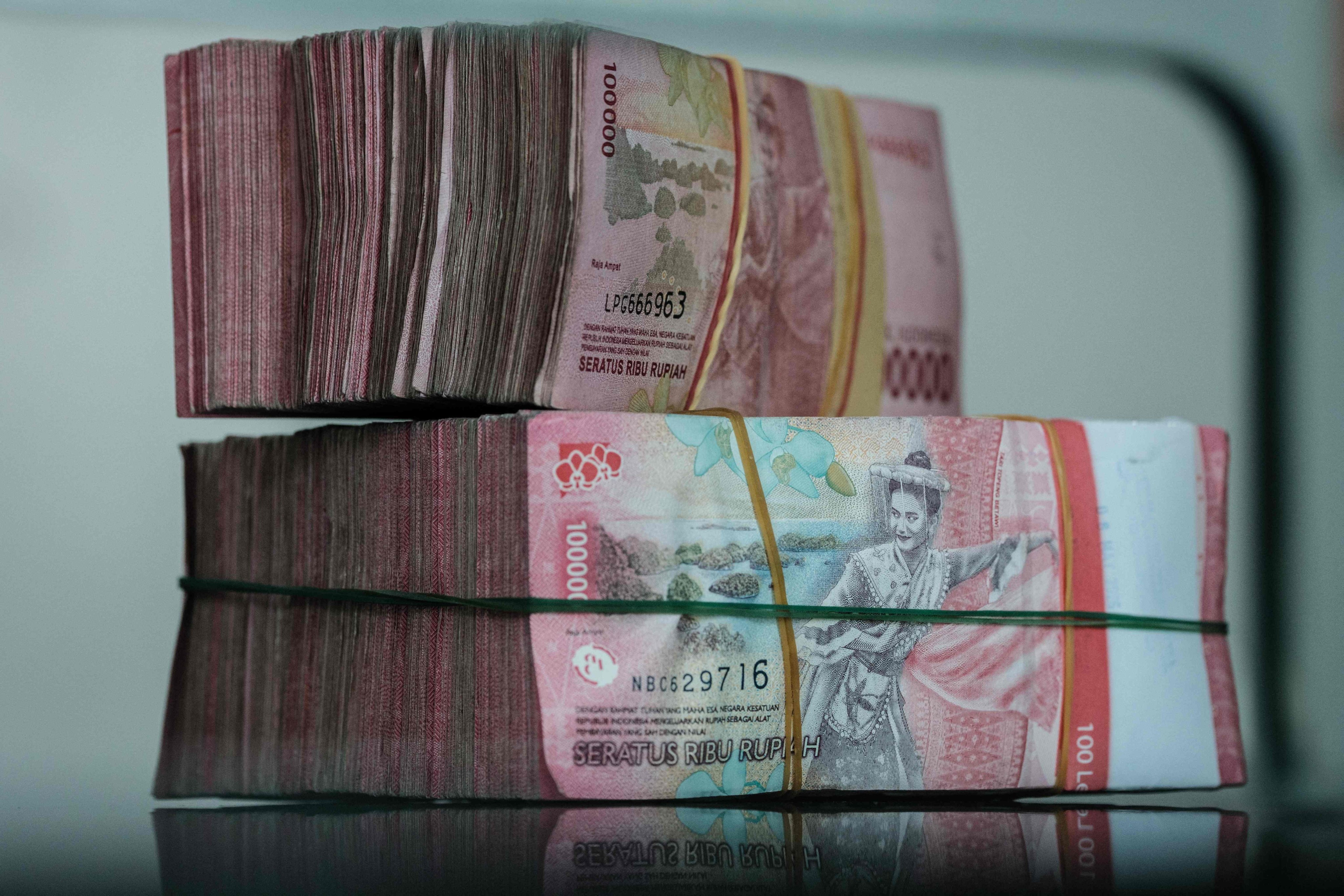 Yuan and rupiah banknotes as Hong Kong, Indonesia and the People's Bank of China sign a direct currency settlement MoU