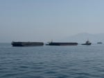 Oil tankers lined up in the Persian Gulf unable to transit the Strait of Hormuz