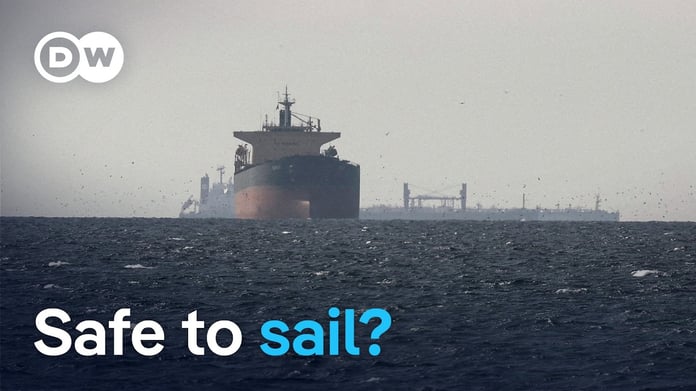 Ships navigating the Strait of Hormuz evacuation corridor before the IMO suspended the programme