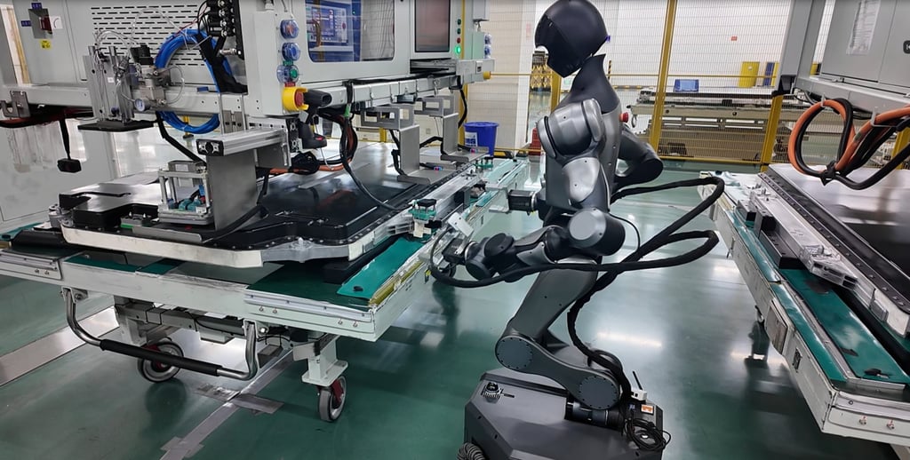 A Xiaomo humanoid robot plugging a high-voltage connector into an electric-vehicle battery on a production line
