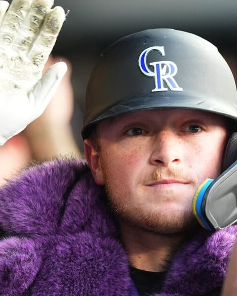 Hunter Goodman gestures after hitting a two-run home run for the Colorado Rockies against the Chicago Cubs at Coors Field on June 9, 2026