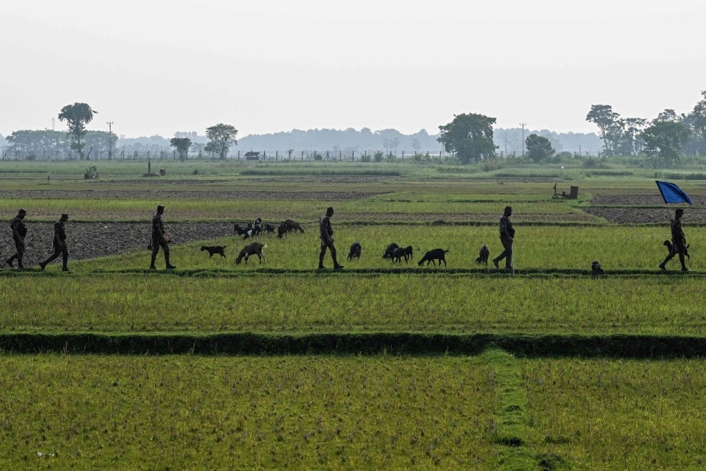Border Guard Bangladesh personnel patrol near the Benapole-Petrapole frontier crossing on the India-Bangladesh border