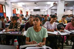 Students attend a coaching institute class in Prayagraj, India, as the CBSE exam scandal exposed by three teenagers grows