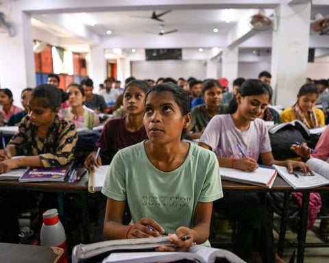 Students attend a coaching institute class in Prayagraj, India, as the CBSE exam scandal exposed by three teenagers grows