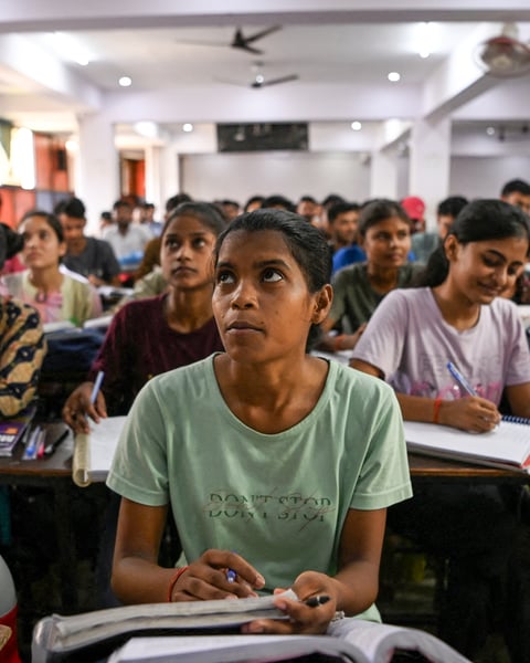 Students attend a coaching institute class in Prayagraj, India, as the CBSE exam scandal exposed by three teenagers grows