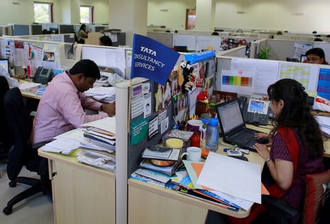 Employees work at the Tata Consultancy Services headquarters in Mumbai, India